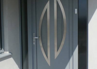 Aluminium entrance door glazed with slate grey hallmark panel